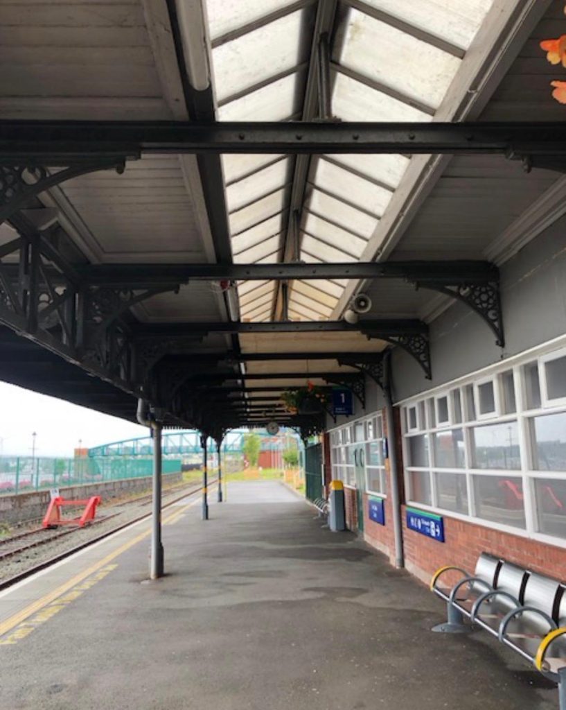 Restored cast iron canopy at Cobh railway station showing replacement brackets and structural supports